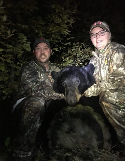 Megan Lunde bagged her first ever big game , and it was a 310lb black bear.  They sat for 40 minutesand it came in. What a rush!  Shot during the 2019 bear season by Baudette