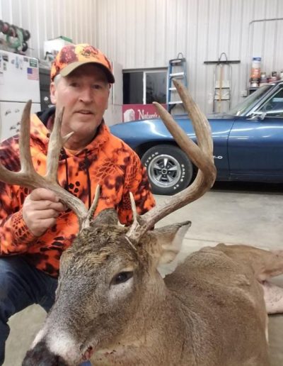 Doug Green got this respectable buck during the MN rifle hunt . Running through the woods at 100 yards