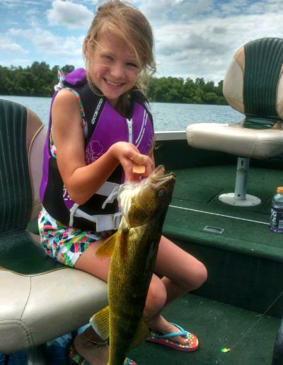 Olivia Budke with a nice walleye caught during the Wee Villa kids Fishing Derby