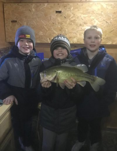 levi budke and friends having some fun in fishhouse on long lake
